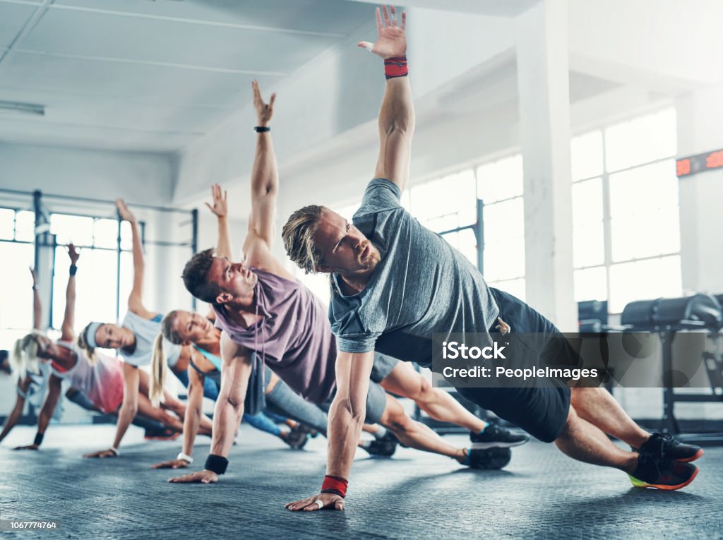 Shot of an accountability group working out at the gym